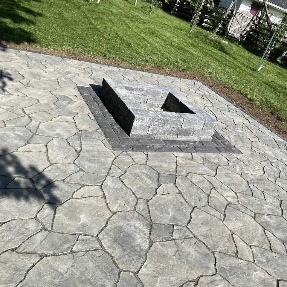 Natural stone patio with a square fire pit