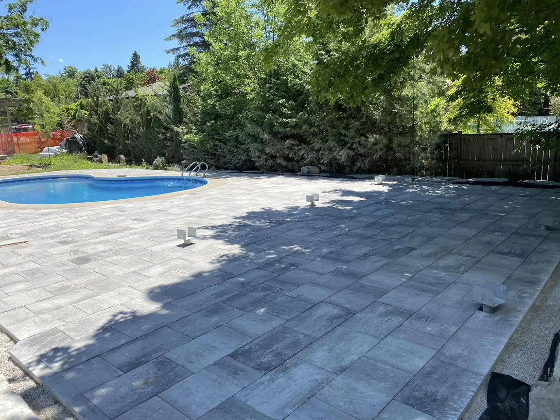 Large interlock pool deck in grey pavers